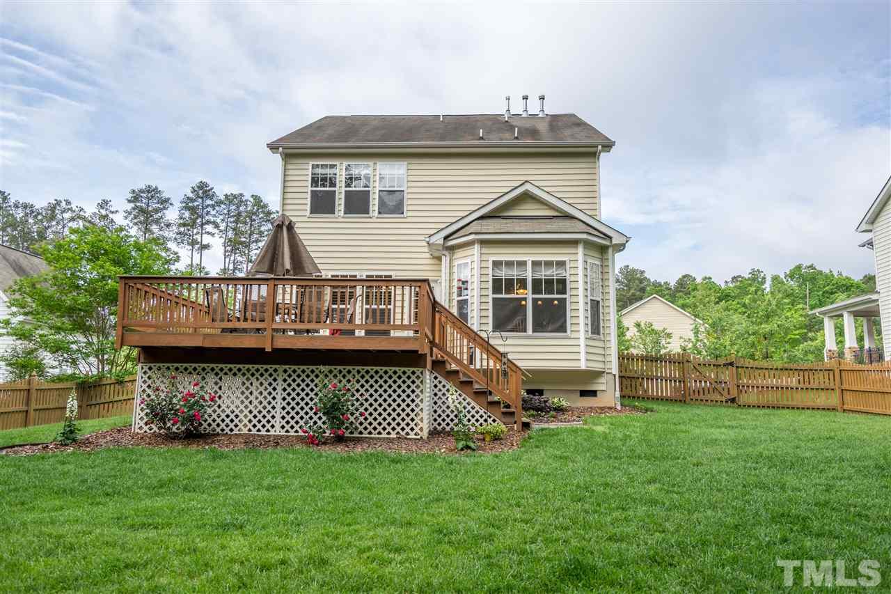 3307 Ranbir Drive Durham, NC 27713 - Photo 24 of 25 a view of a house with a wooden deck and a yard