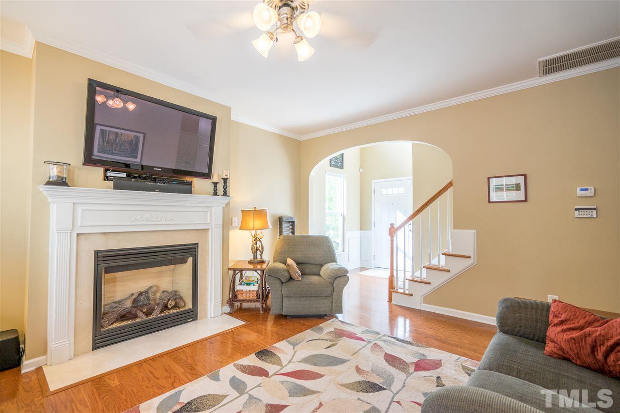 3307 Ranbir Drive Durham, NC 27713 - Photo 6 of 25 a living room with furniture and a fireplace