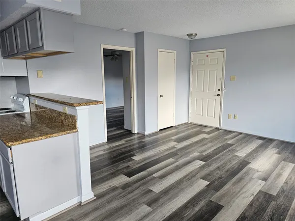 a bedroom with a bed and a ceiling fan