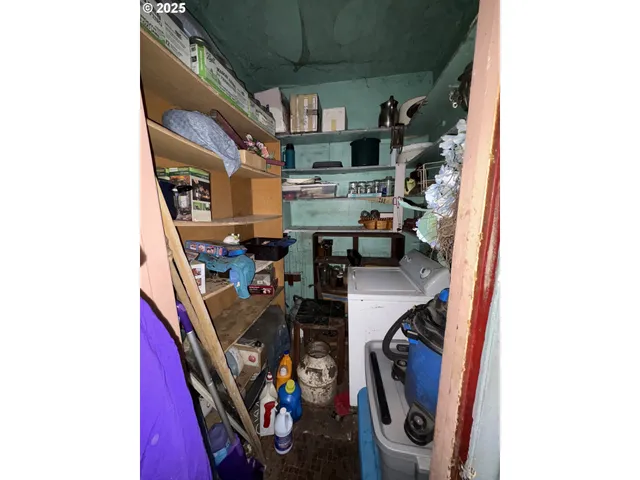 a view of storage and utility room with washer and dryer