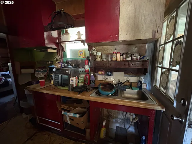 a kitchen with lots of counter top space and a sink