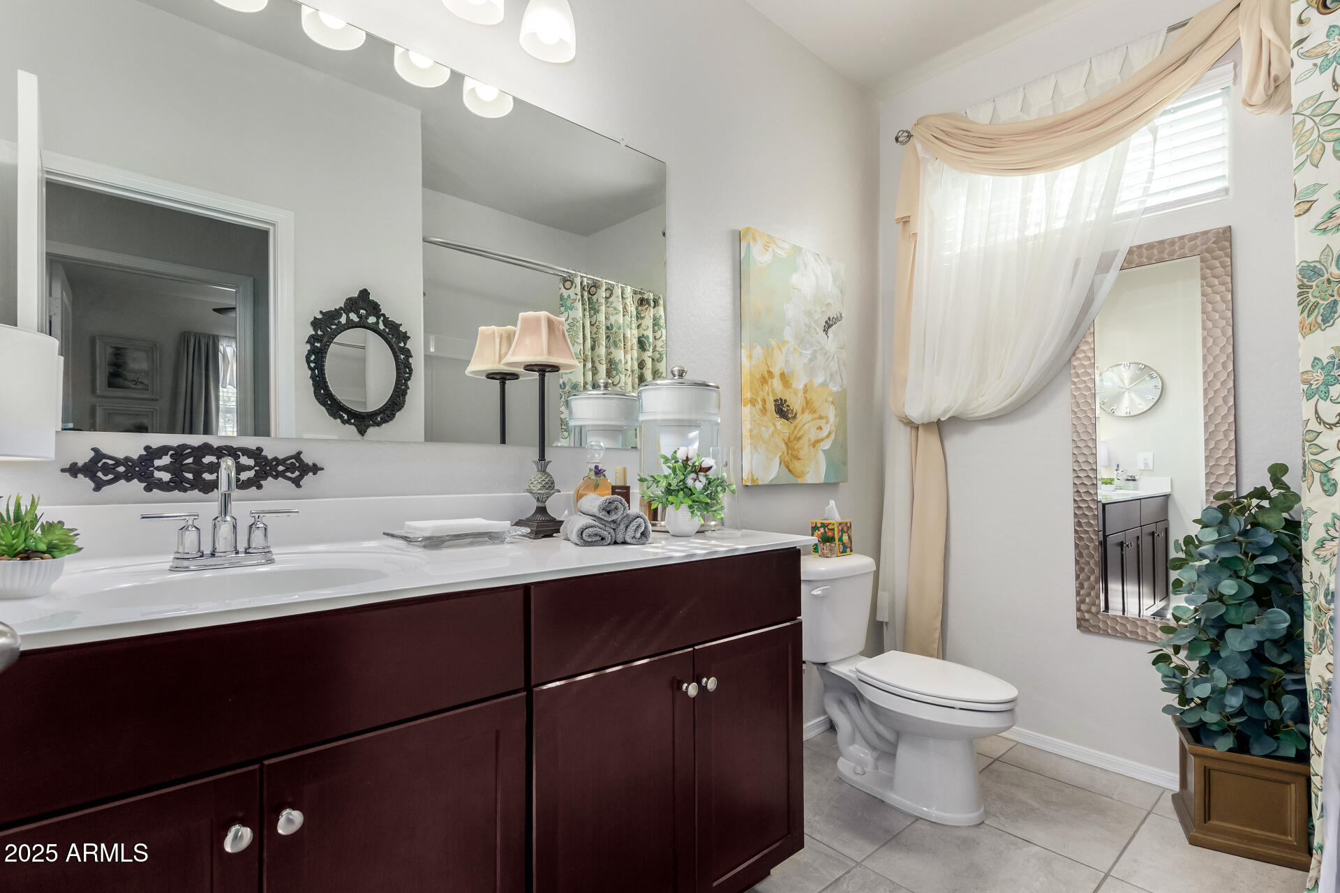 24077 Field Road Florence, AZ 85132 - Photo 27 of 34 a bathroom with a toilet sink and mirror