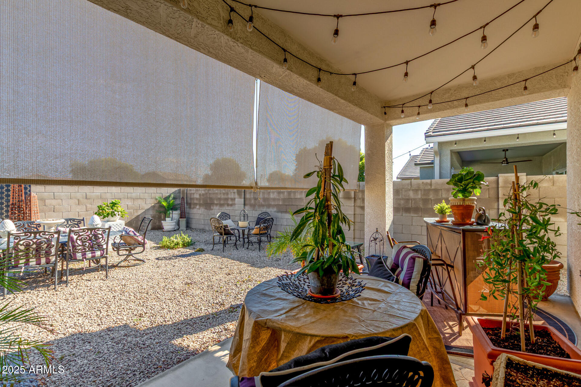 24077 Field Road Florence, AZ 85132 - Photo 29 of 34 a view of outdoor kitchen with dining table and chairs