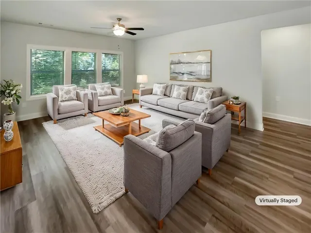 a living room with furniture and a large window