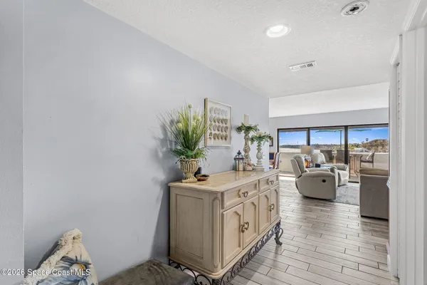 a kitchen with stainless steel appliances kitchen island granite countertop a refrigerator and a sink