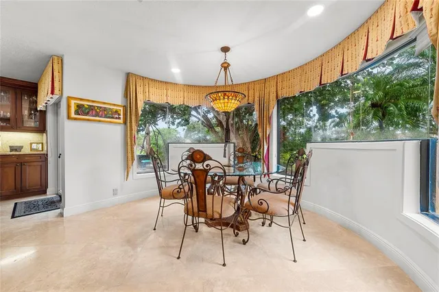 a view of a dining room with furniture window and outside view