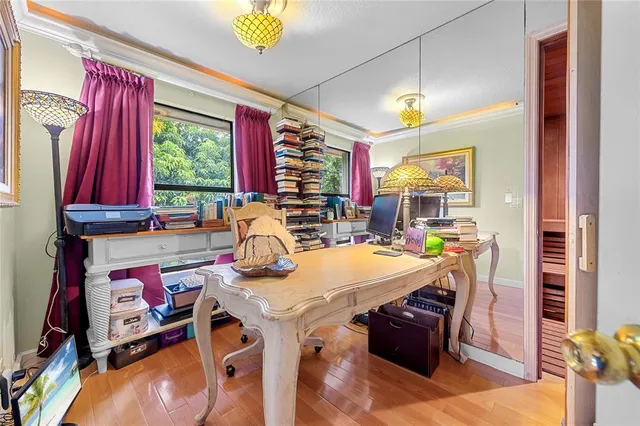 a living room with furniture and a book shelf