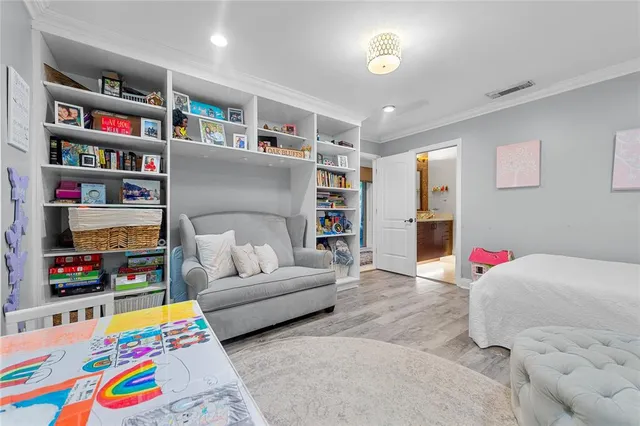 a bedroom with bed and window