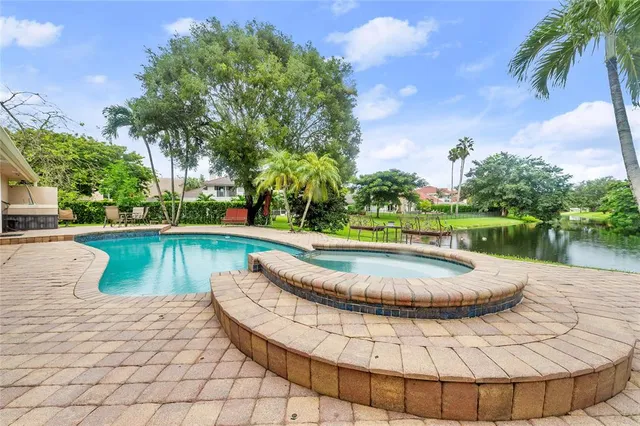 a patio with yard and outdoor seating