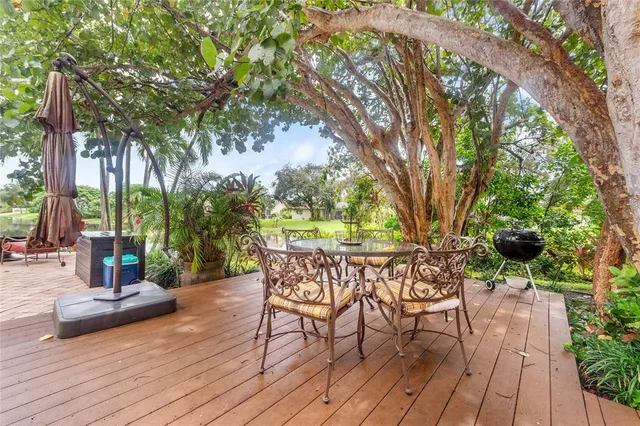 a front view of a house with a yard table and chairs