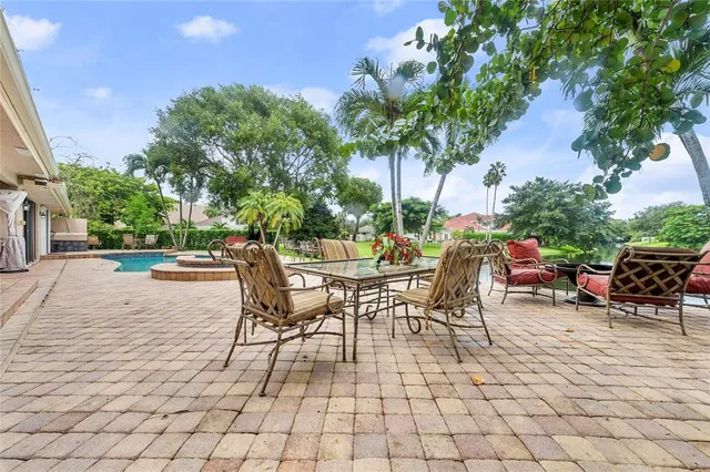 a view of a lake with table and chairs and a lake view
