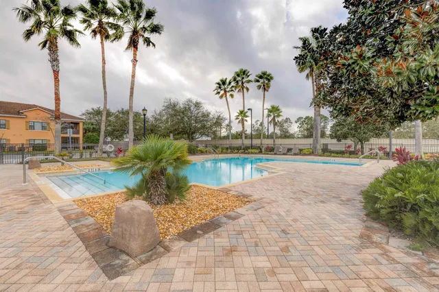 a house with palm tree in front of it