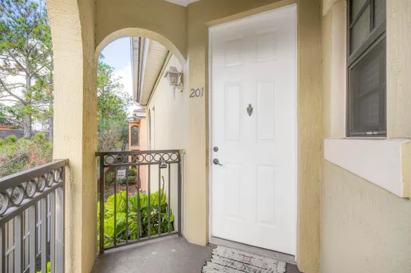 a view of a door with a porch