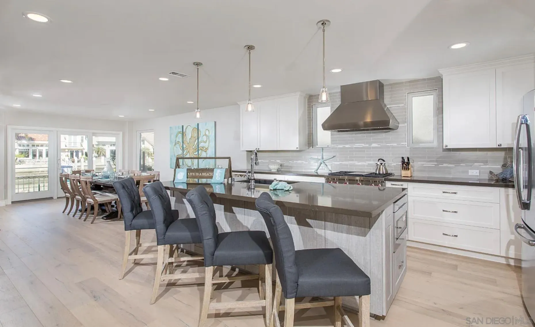 48 Spinnaker Way Coronado, CA 92118 - Photo 11 of 29 a large kitchen with a table and chairs