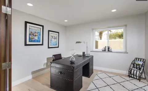 a view of workspace with window and couch