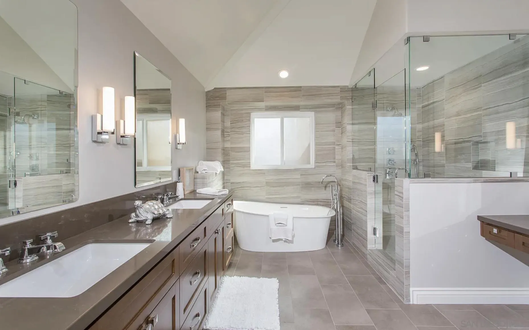 48 Spinnaker Way Coronado, CA 92118 - Photo 19 of 29 a bathroom with a double vanity sink toilet and mirror
