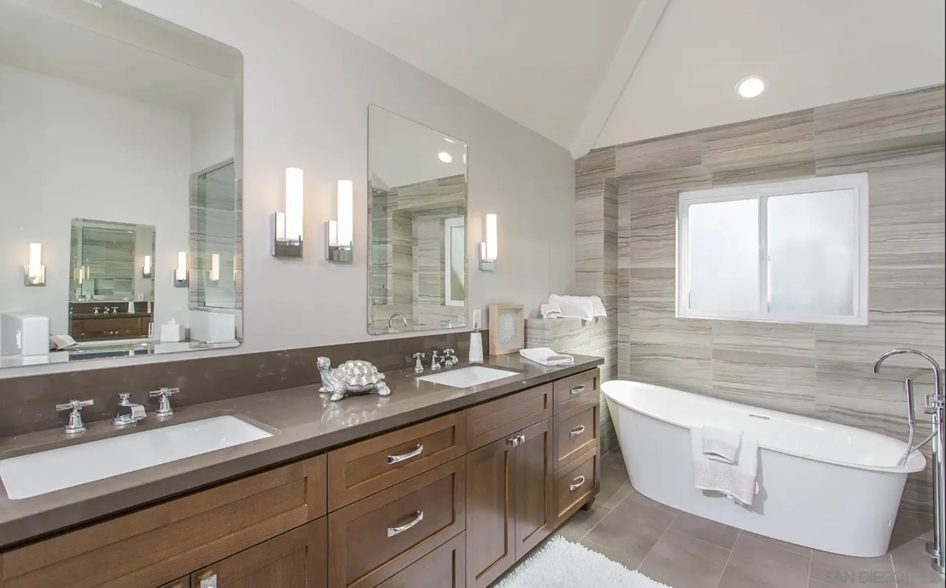 48 Spinnaker Way Coronado, CA 92118 - Photo 22 of 29 a bathroom with a granite countertop double vanity sink a mirror and a bathtub