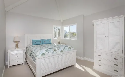 a bedroom with a bed and a window in it