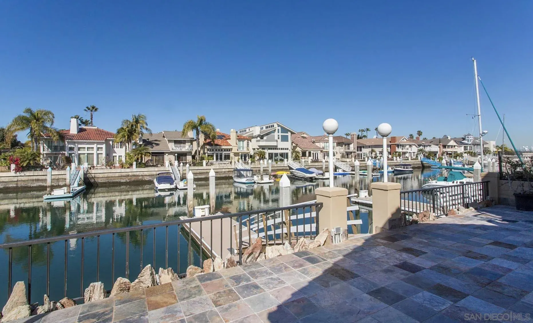 48 Spinnaker Way Coronado, CA 92118 - Photo 5 of 29 a view of a chairs and table on the terrace