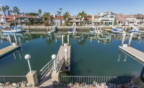 a view of a lake with a house in the background