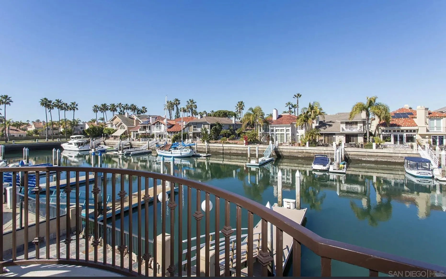 48 Spinnaker Way Coronado, CA 92118 - Photo 7 of 29 a view of a lake with boats and trees in the background