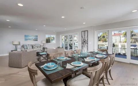 a dining room with furniture a window and a dining table
