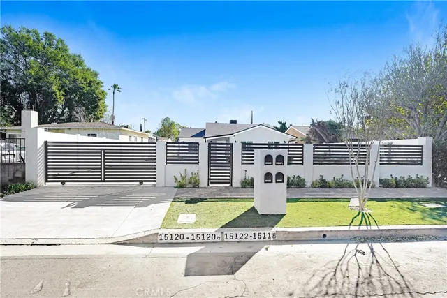 a view of a house with swimming pool and sitting area