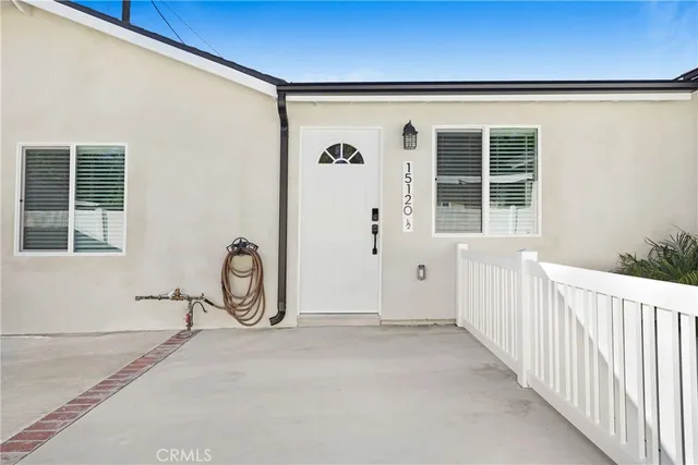 a view of a door and a window
