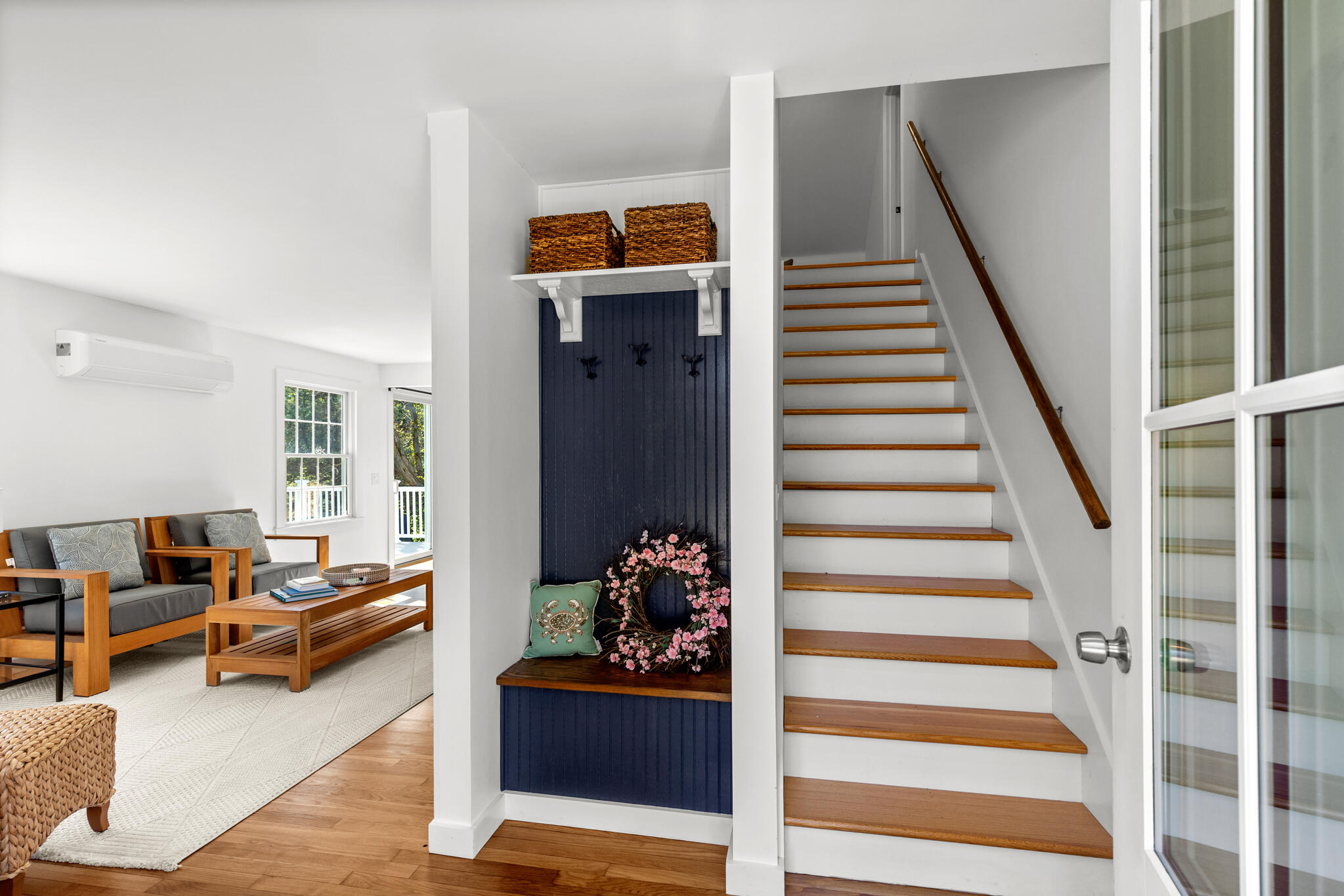 1295 Massasoit Road Eastham, MA 02642 - Photo 25 of 32 a living room with furniture and stairs