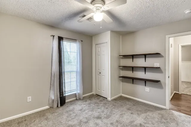an empty room with shelves