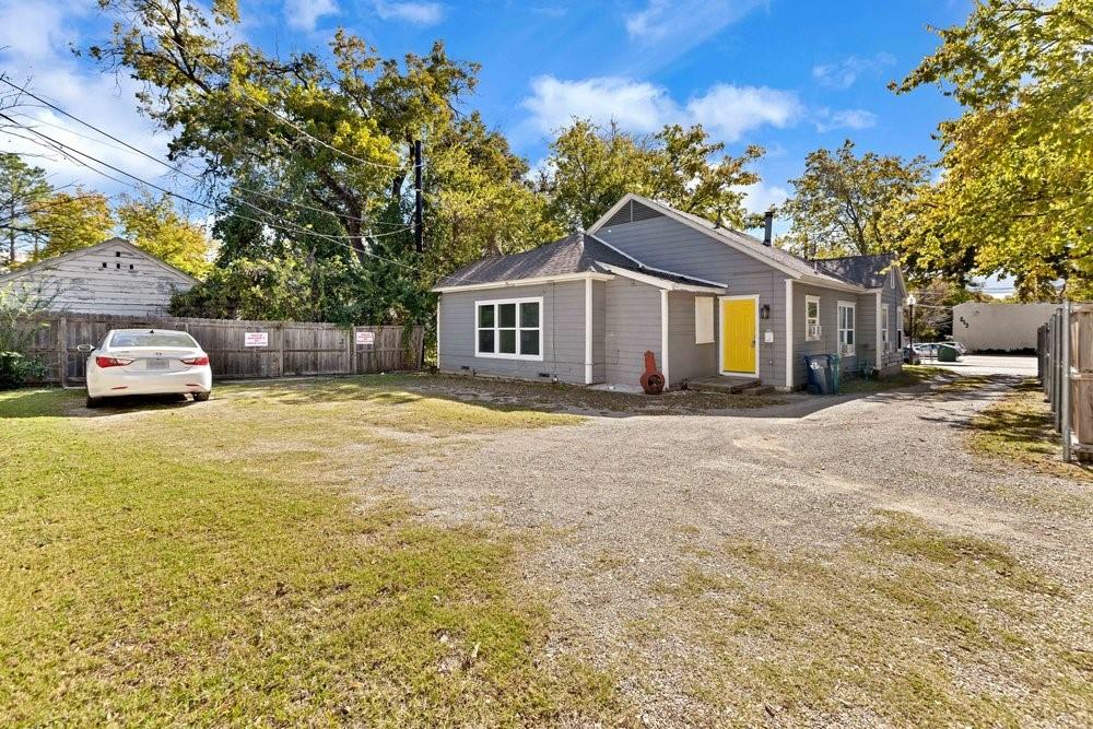 608 West Hickory Street, Unit B Denton, TX 76201 - Photo 1 of 19 a front view of a house with a garden