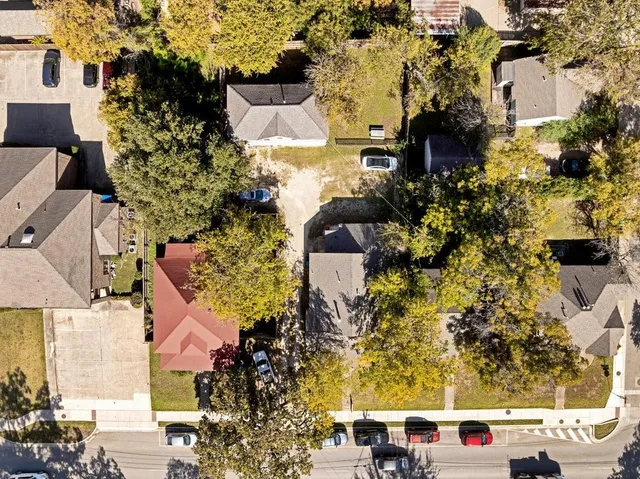 an aerial view of residential houses with outdoor space
