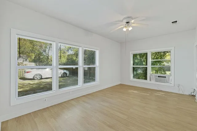 a view of an empty room with a window