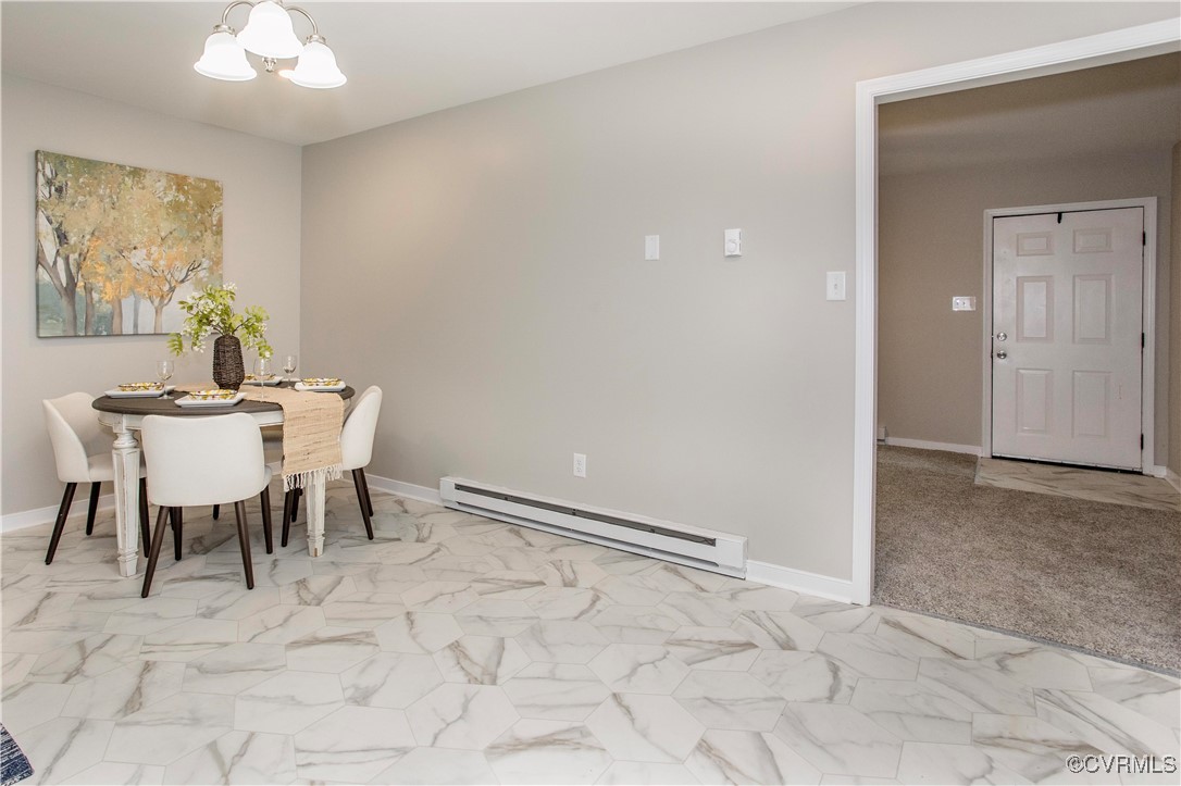 7856 Epic Road Richmond, VA 23235 - Photo 11 of 32 Dining area with a baseboard radiator, a chandelie