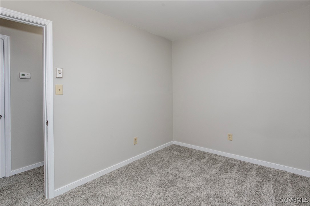 7856 Epic Road Richmond, VA 23235 - Photo 15 of 32 Spare room with carpet floors and baseboards