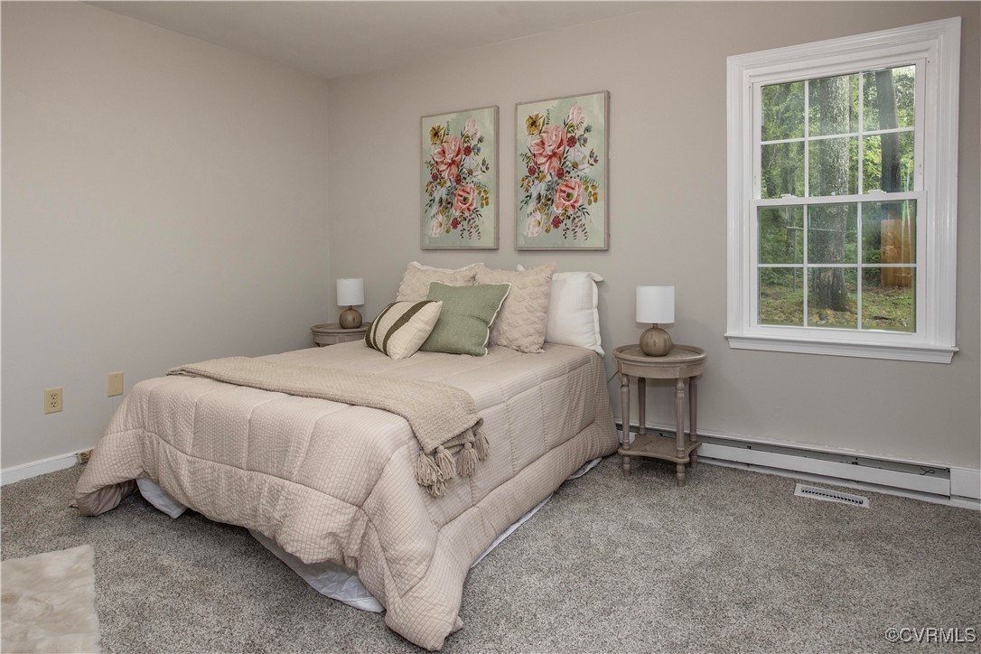 7856 Epic Road Richmond, VA 23235 - Photo 16 of 32 Bedroom featuring a baseboard heating unit and car