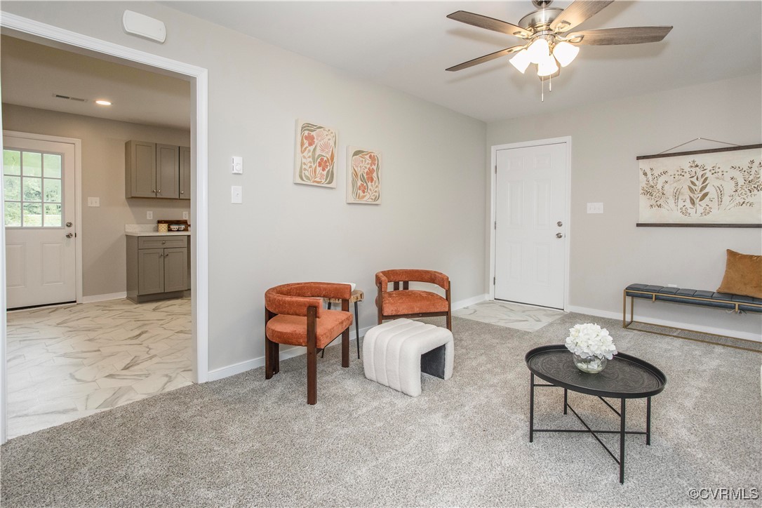7856 Epic Road Richmond, VA 23235 - Photo 23 of 32 Living room featuring ceiling fan and light carpet