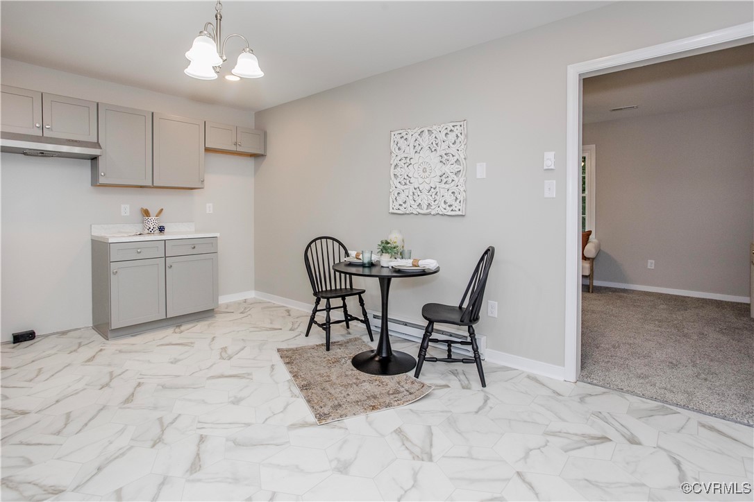 7856 Epic Road Richmond, VA 23235 - Photo 25 of 32 Dining area featuring light marble finish flooring