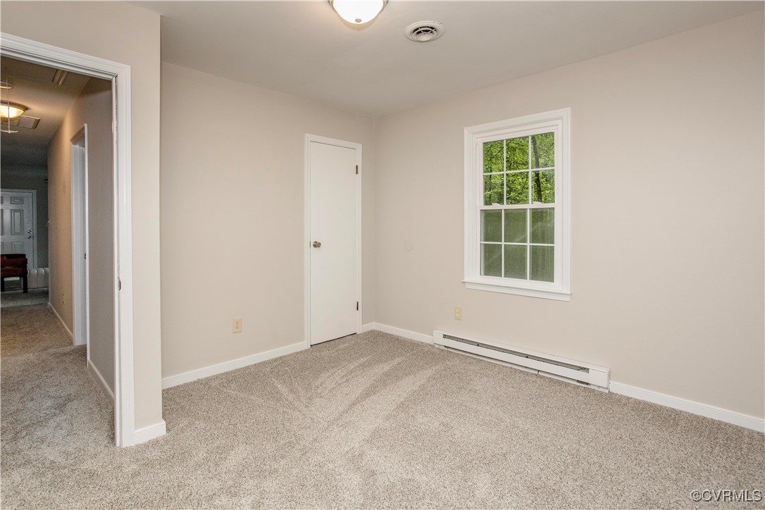 7856 Epic Road Richmond, VA 23235 - Photo 29 of 32 Unfurnished bedroom with a baseboard radiator, car