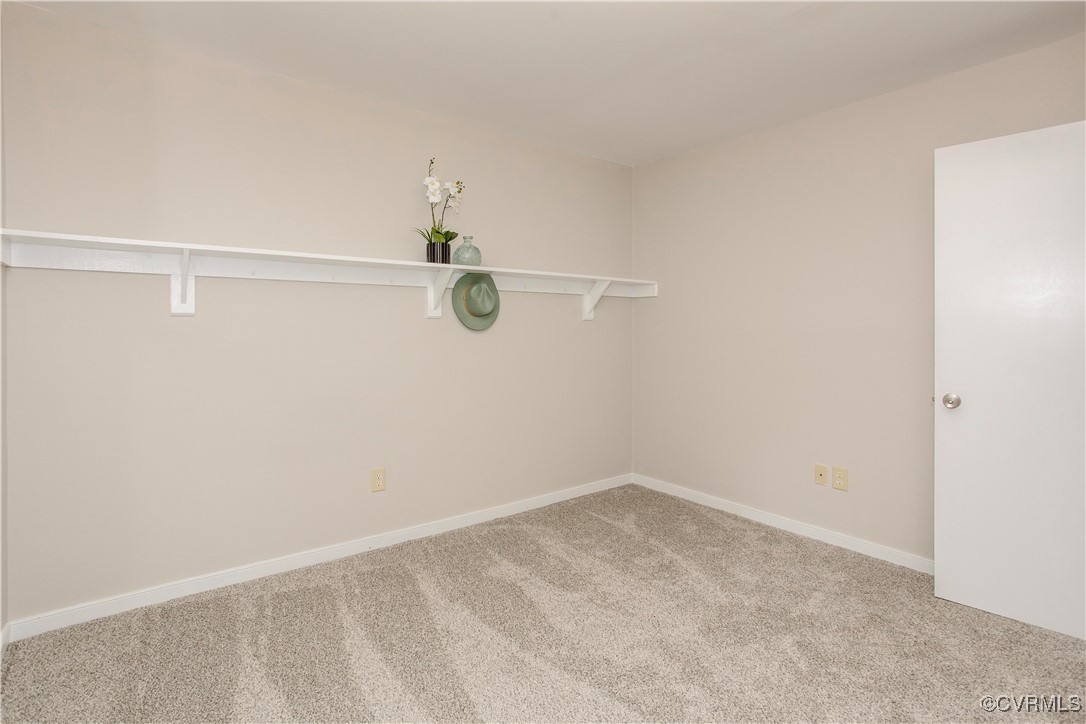7856 Epic Road Richmond, VA 23235 - Photo 30 of 32 Carpeted spare room featuring baseboards