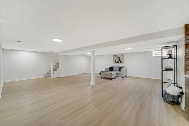 a view of a livingroom with furniture and a flat screen tv