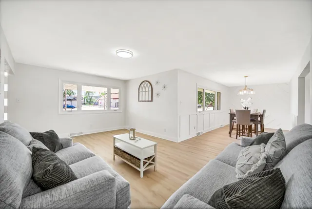 a living room with furniture and a table
