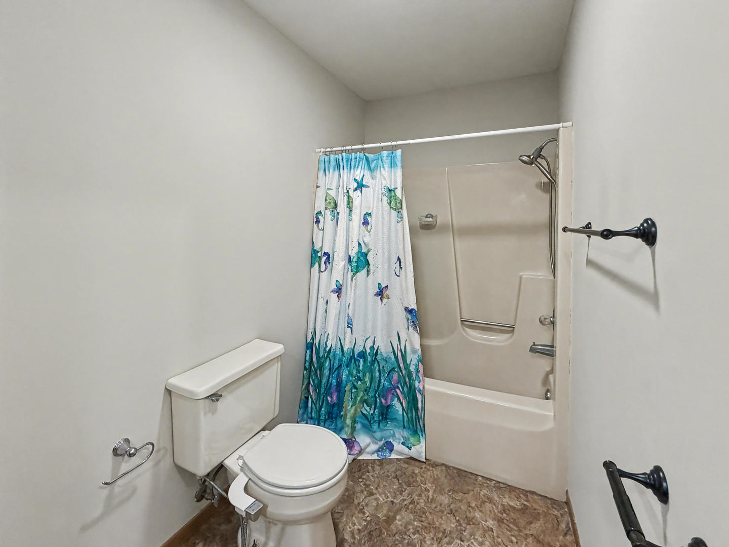 707 East Ash Street Watseka, IL 60970 - Photo 13 of 14 a white toilet sitting next to a bath tub