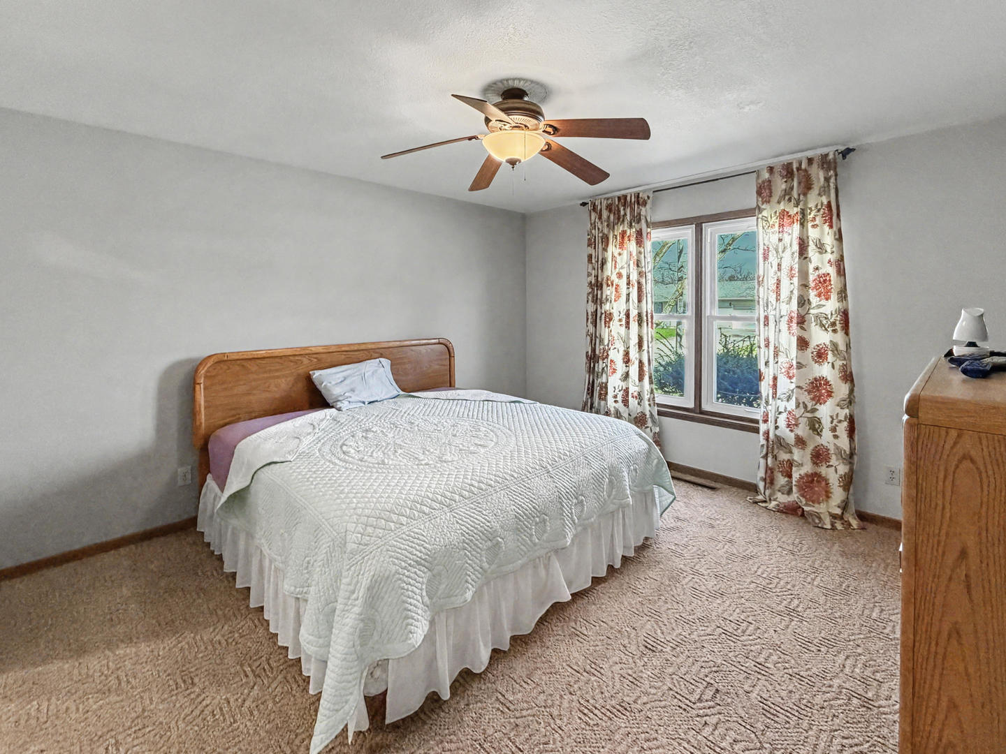 707 East Ash Street Watseka, IL 60970 - Photo 8 of 14 a bed sitting in a bedroom next to a window