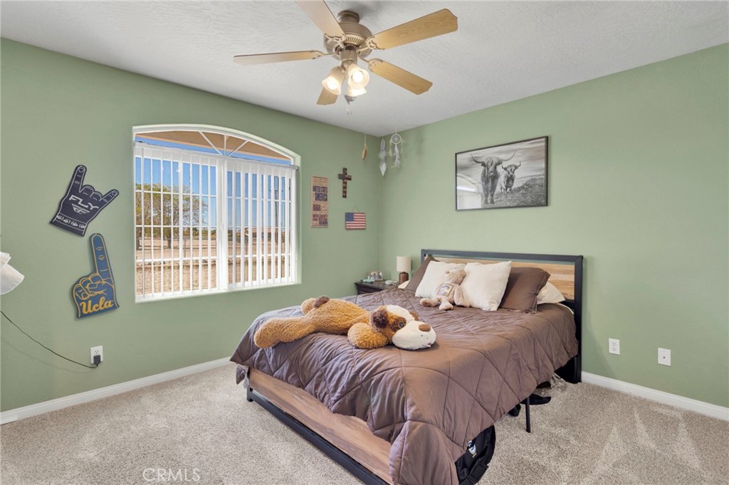 12871 Alta Vista Road Pinon Hills, CA 92372 - Photo 20 of 40 a bedroom with a bed and a window