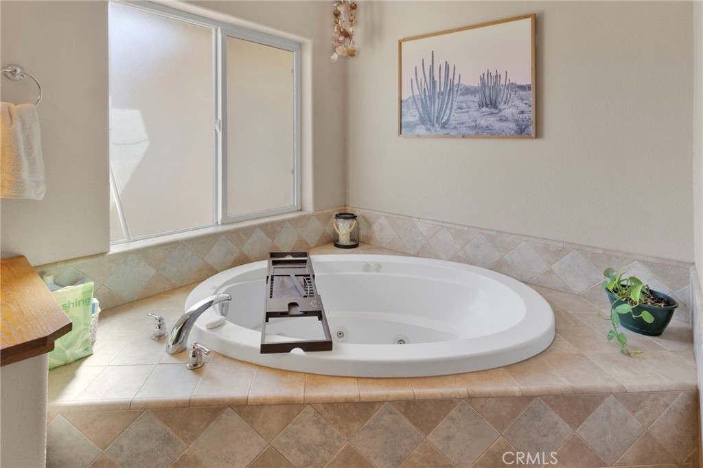 12871 Alta Vista Road Pinon Hills, CA 92372 - Photo 27 of 40 a white bath tub sitting in a bathroom