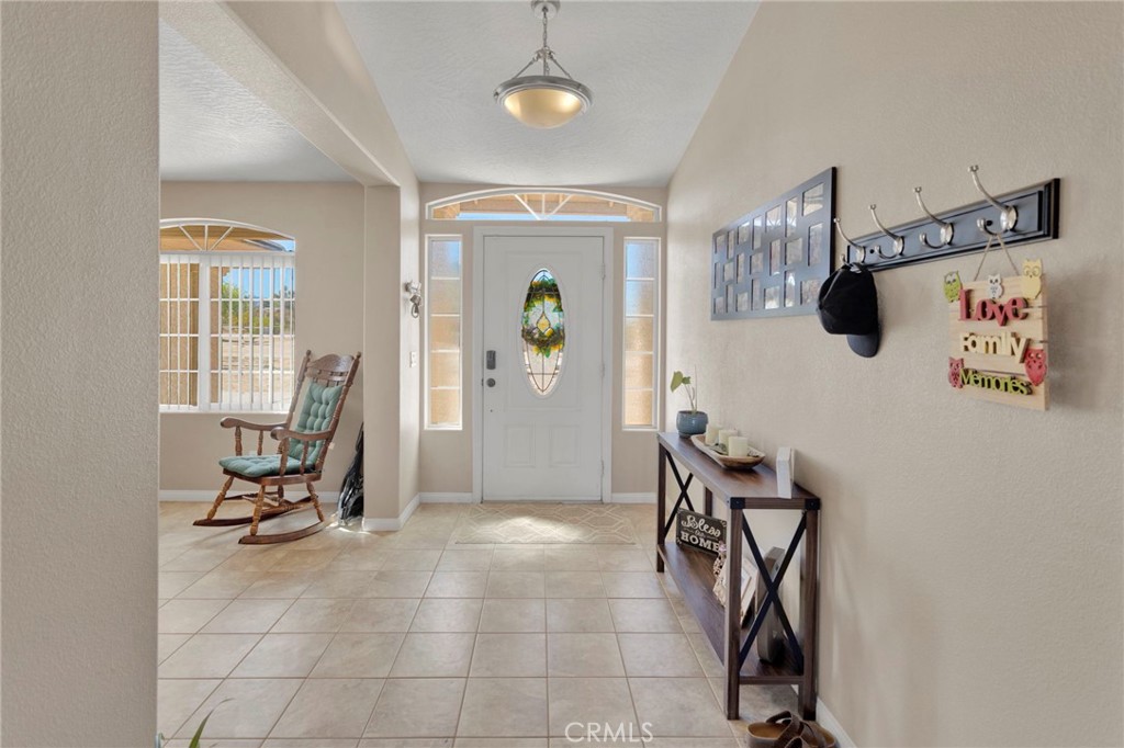 12871 Alta Vista Road Pinon Hills, CA 92372 - Photo 5 of 40 a view of a livingroom with furniture and a window