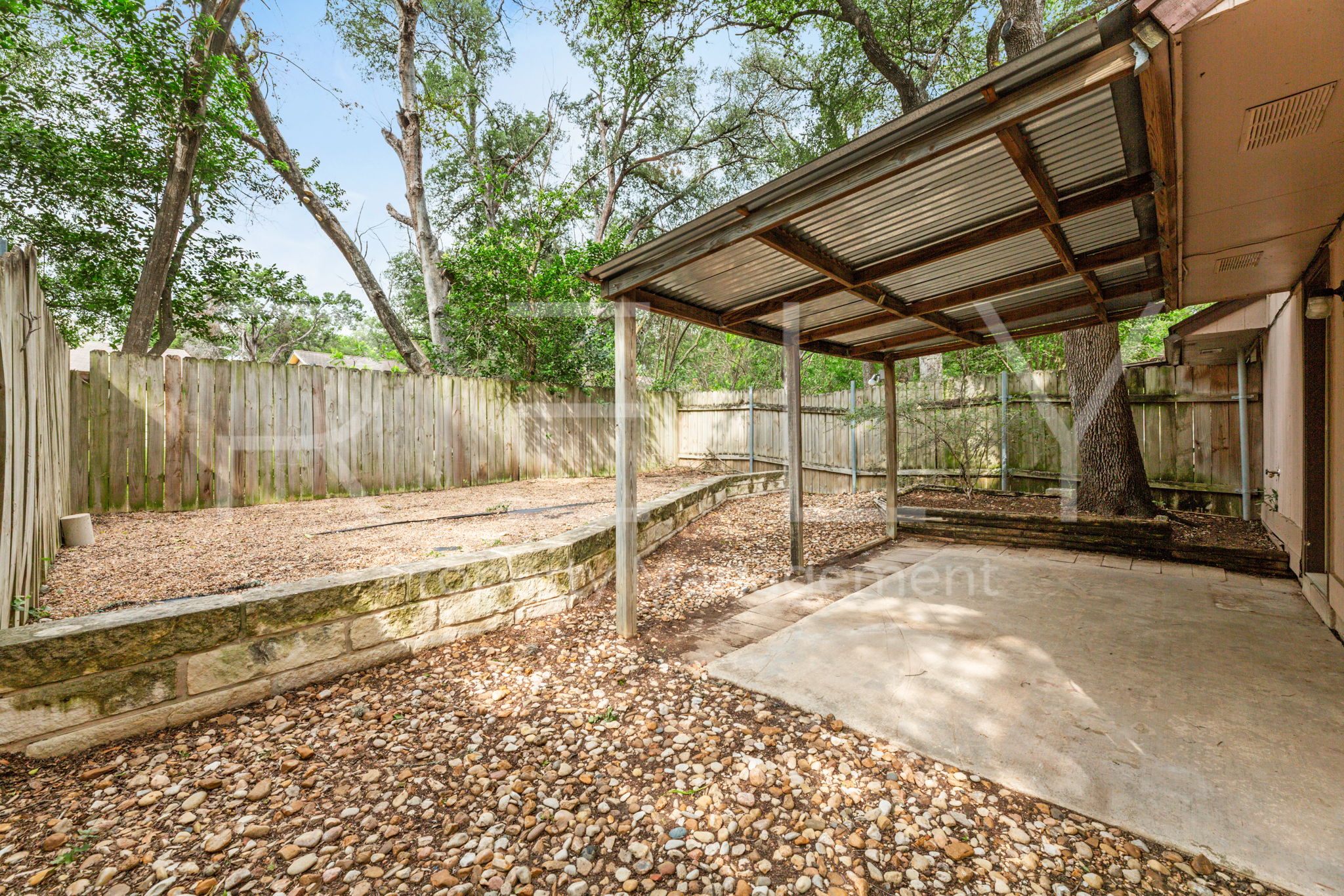 1005 Milford Way, Unit A Austin, TX 78745 - Photo 28 of 30 a view of backyard with wooden fence