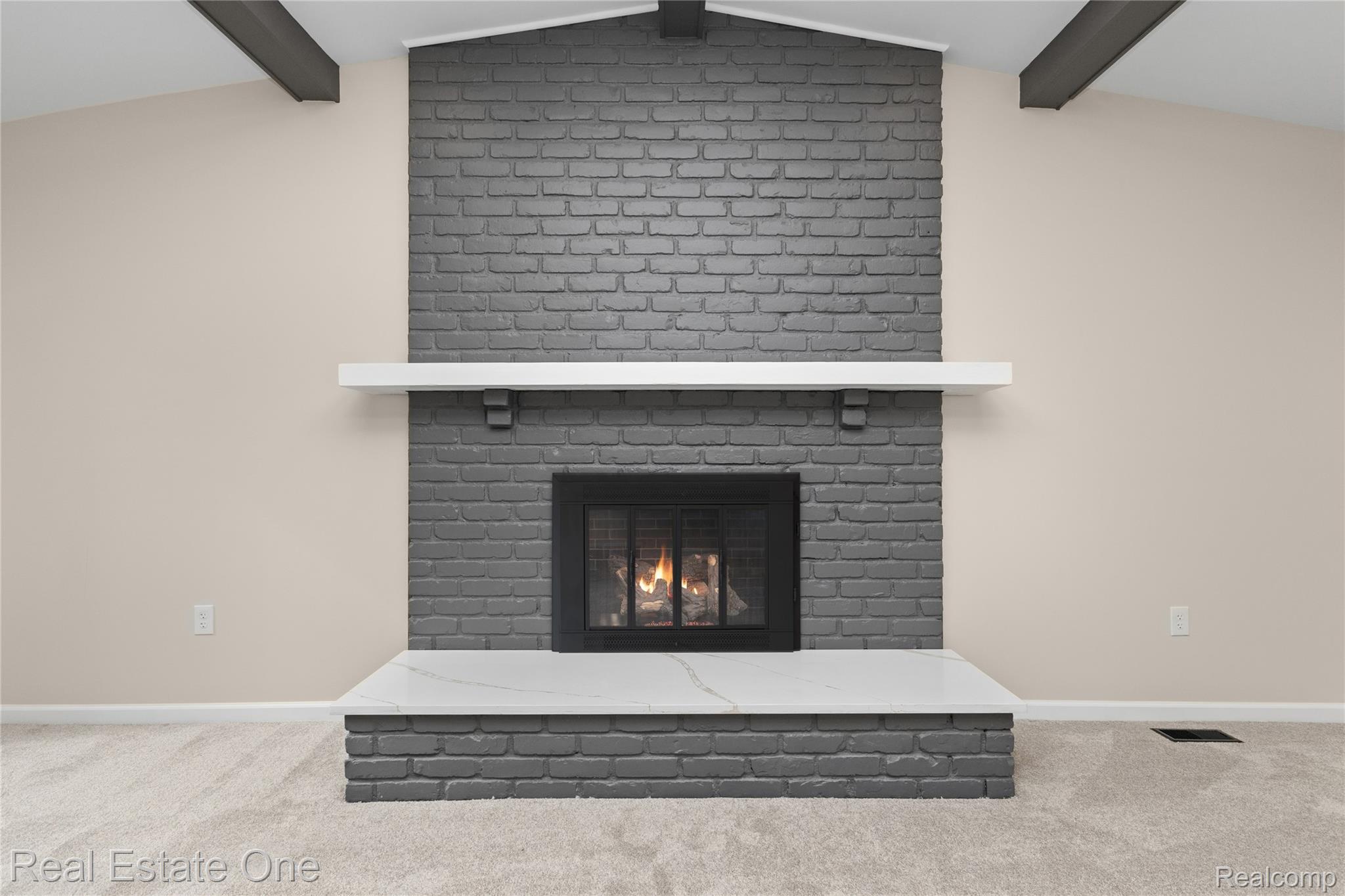 25695 Branchaster Road Farmington, MI 48336 - Photo 26 of 58 Painted brick fireplace with a white mantel and hearth