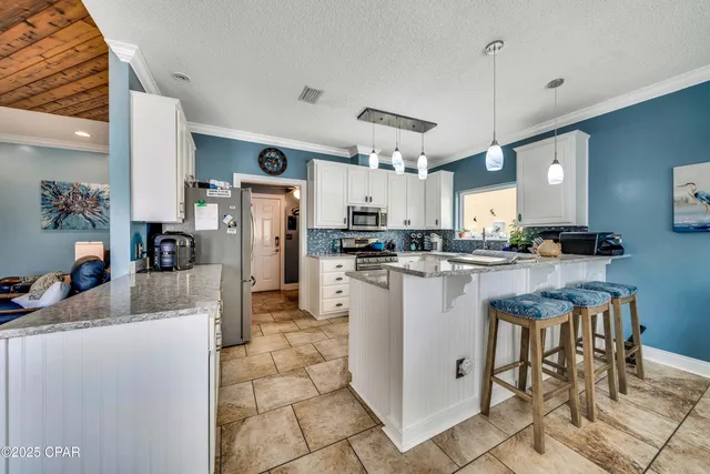 $705,000 | 7009 North Lagoon Drive, Unit 107, Panama City, FL 32408